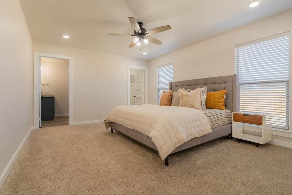 Pamela Interior Comp Photo of a furnished master bedroom in Betenbough Homes' Pamela floor plan.
