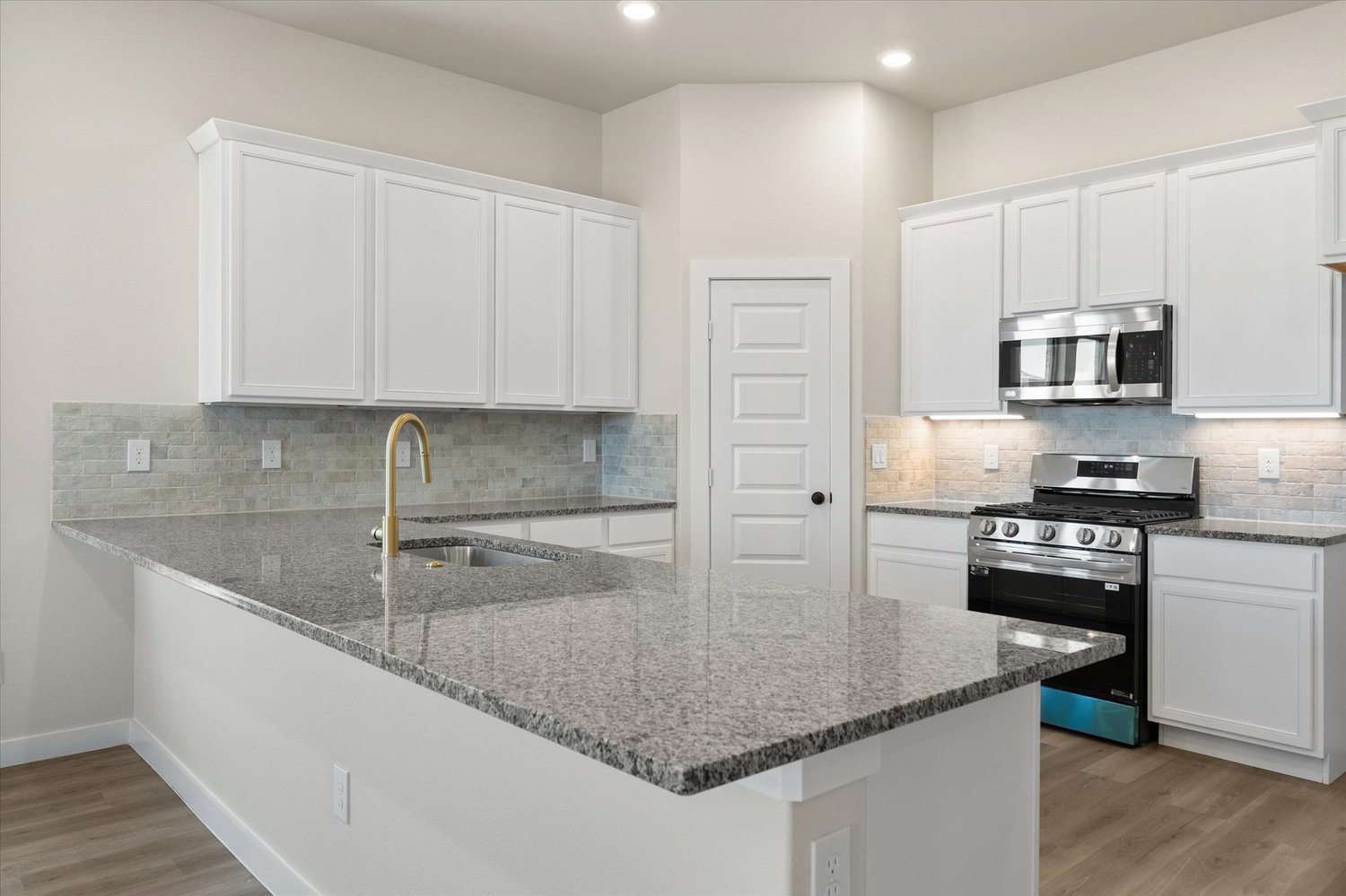 Photo of kitchen in the Nikki, one of Betenbough's homes with open floor plan.