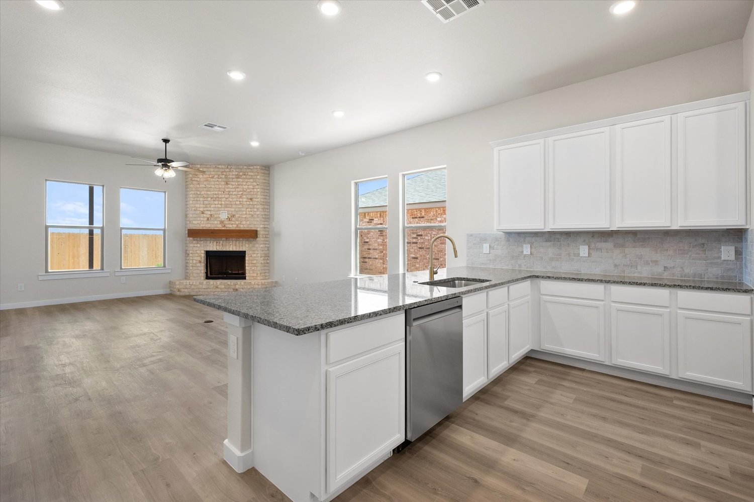 Photo of kitchen peninsula in the Nikki, a Betenbough Homes floor plan.