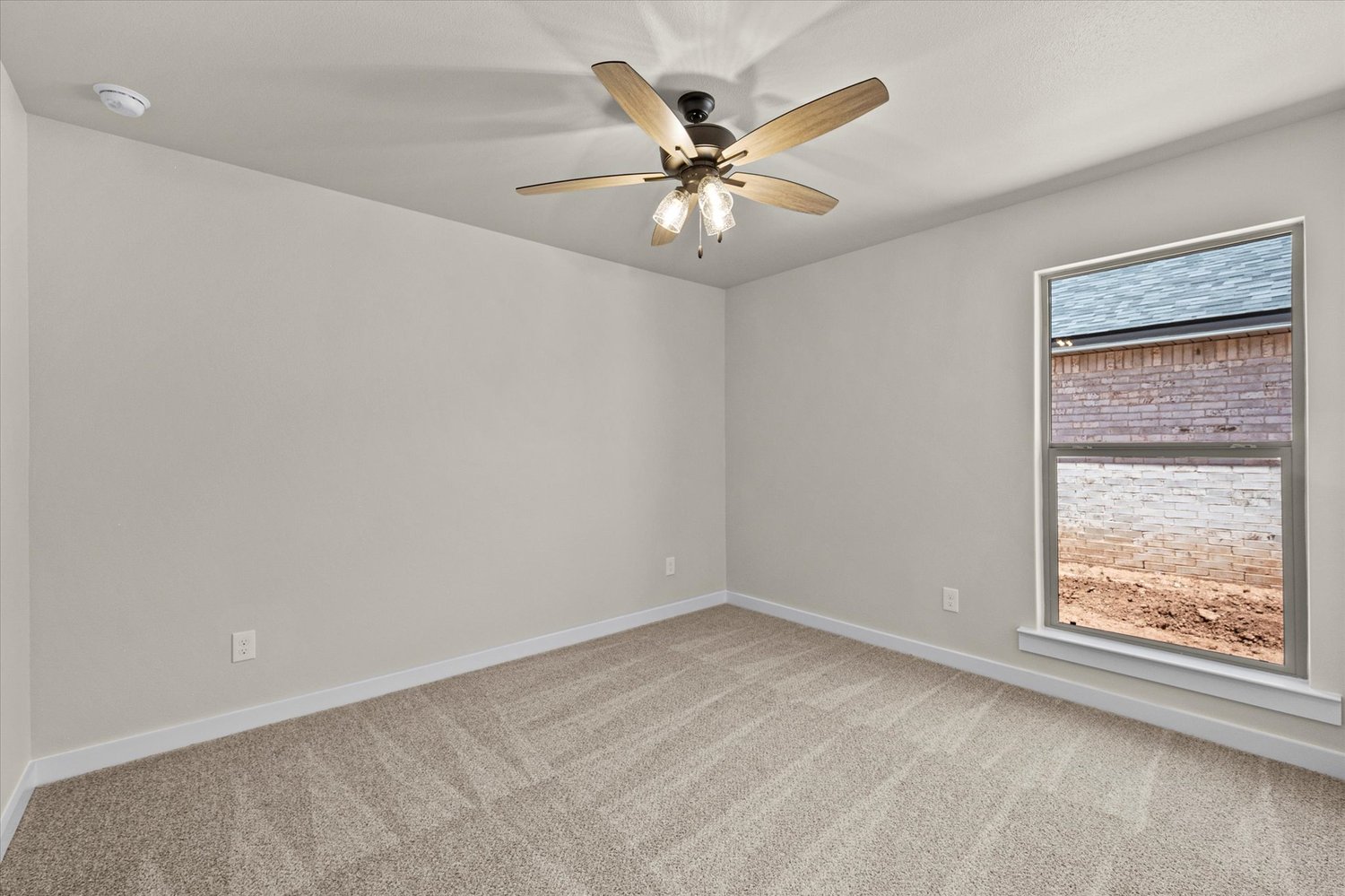 Photo of bedroom & window in the Dorris, a Betenbough Homes floor plan.