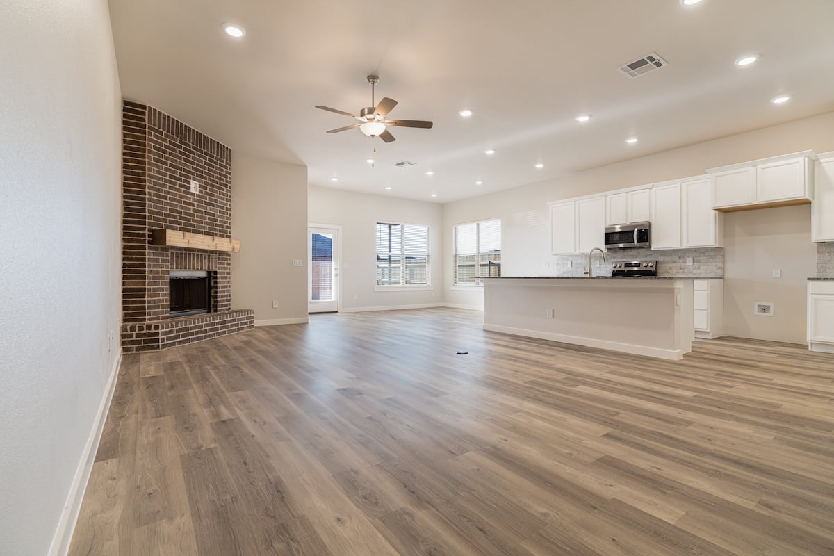 Photo of the living area, dining area, and kitchen in the Layla, a Betenbough home