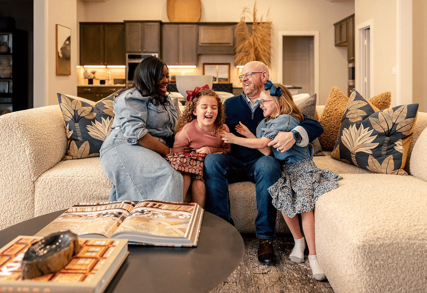 Family laughing together in living room