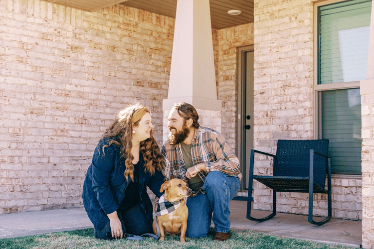 Happy couple in front of their Betenbough home