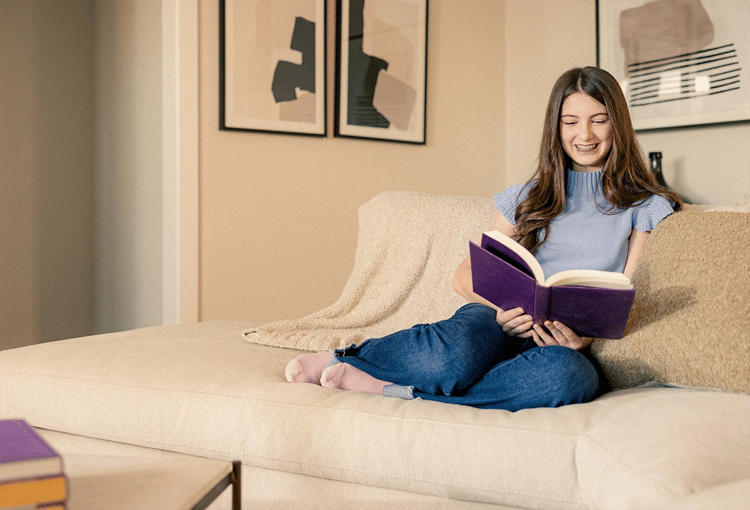 Girl reading on couch