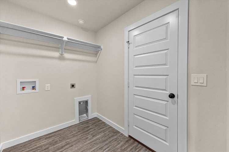 Photo of utility room in the Dorris, one of Betenbough's homes with a walk-in closet.