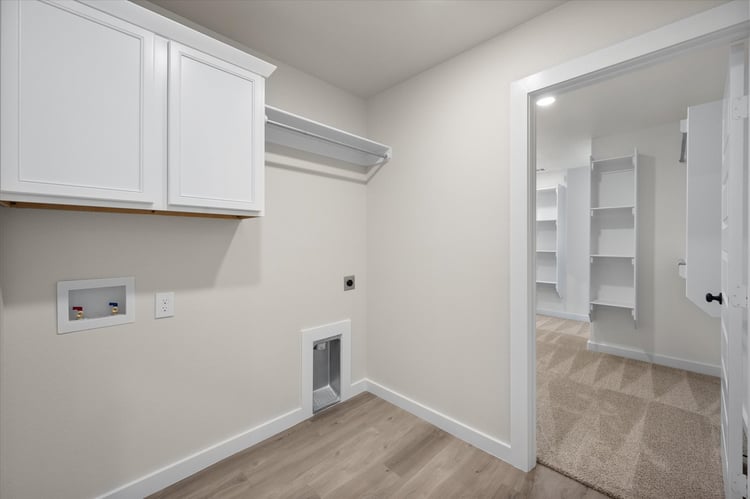 Photo of utility room in the Nikki, a Betenbough Homes floor plan.