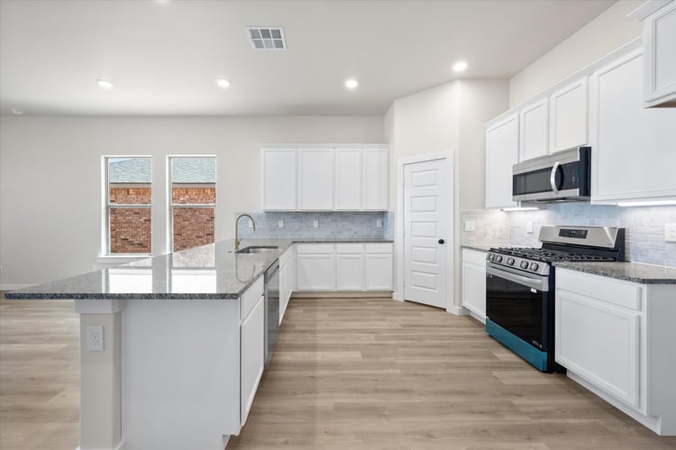 Photo of kitchen in the Nikki, a floor plan by Betenbough Homes, West Texas' #1 home builder.