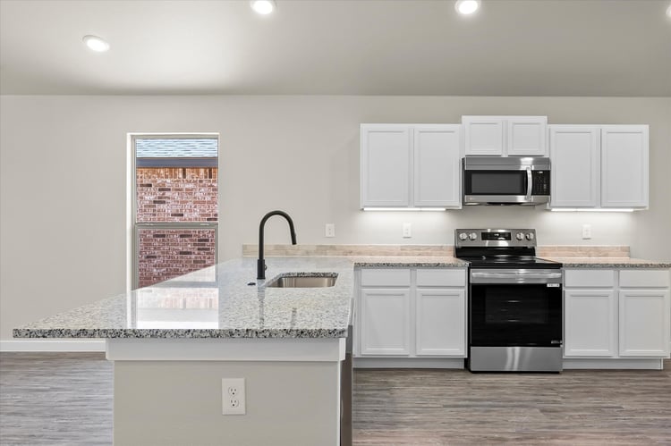 Photo of the kitchen in the Dorris, one of Betenbough's homes with a walk-in closet.