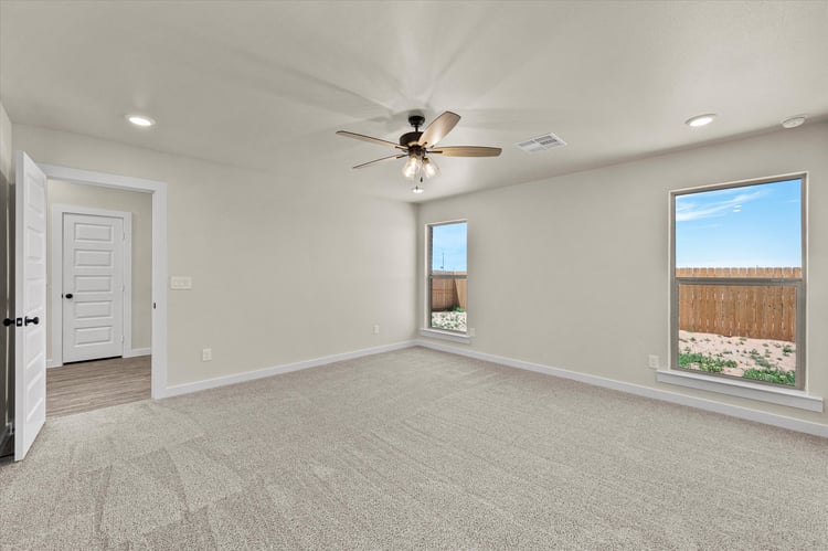 Photo of a carpeted bedroom in the Dorris, a Betenbough Homes floor plan.