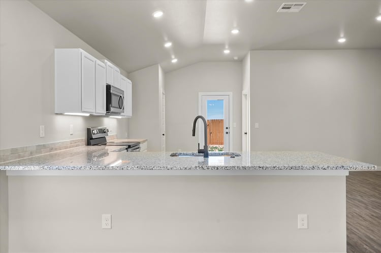 Photo of kitchen peninsula in the Dorris, a Betenbough Homes floor plan.