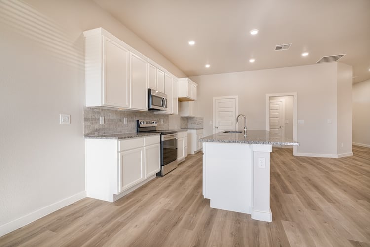 Photo from the dining area looking into the kitchen of the Layla, a Betenbough home