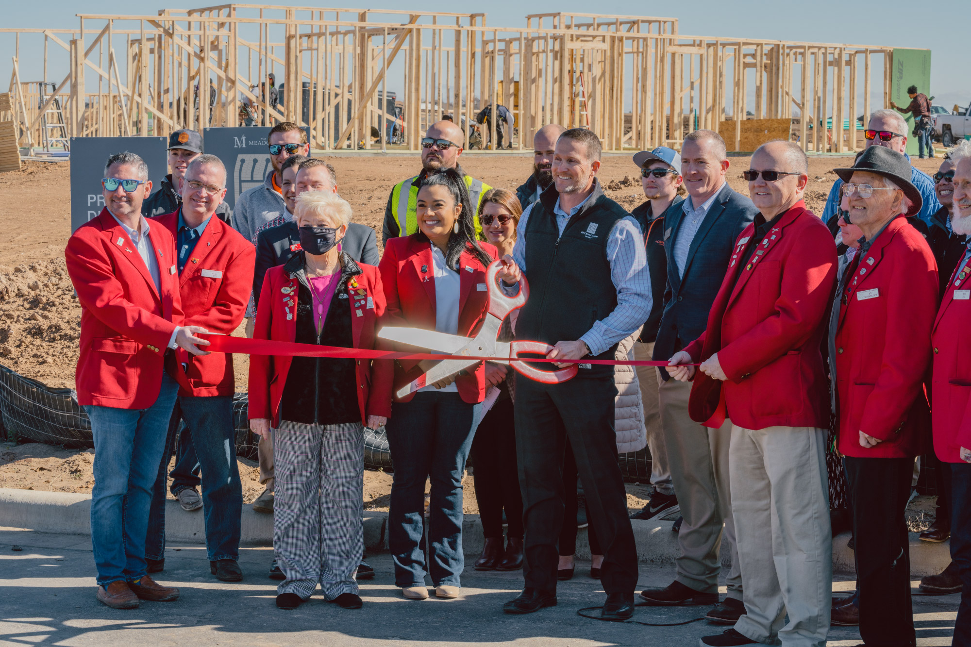 Photo of the Amarillo team at a ribbon cutting for The Meadows, a Betenbough Community in Amarillo.