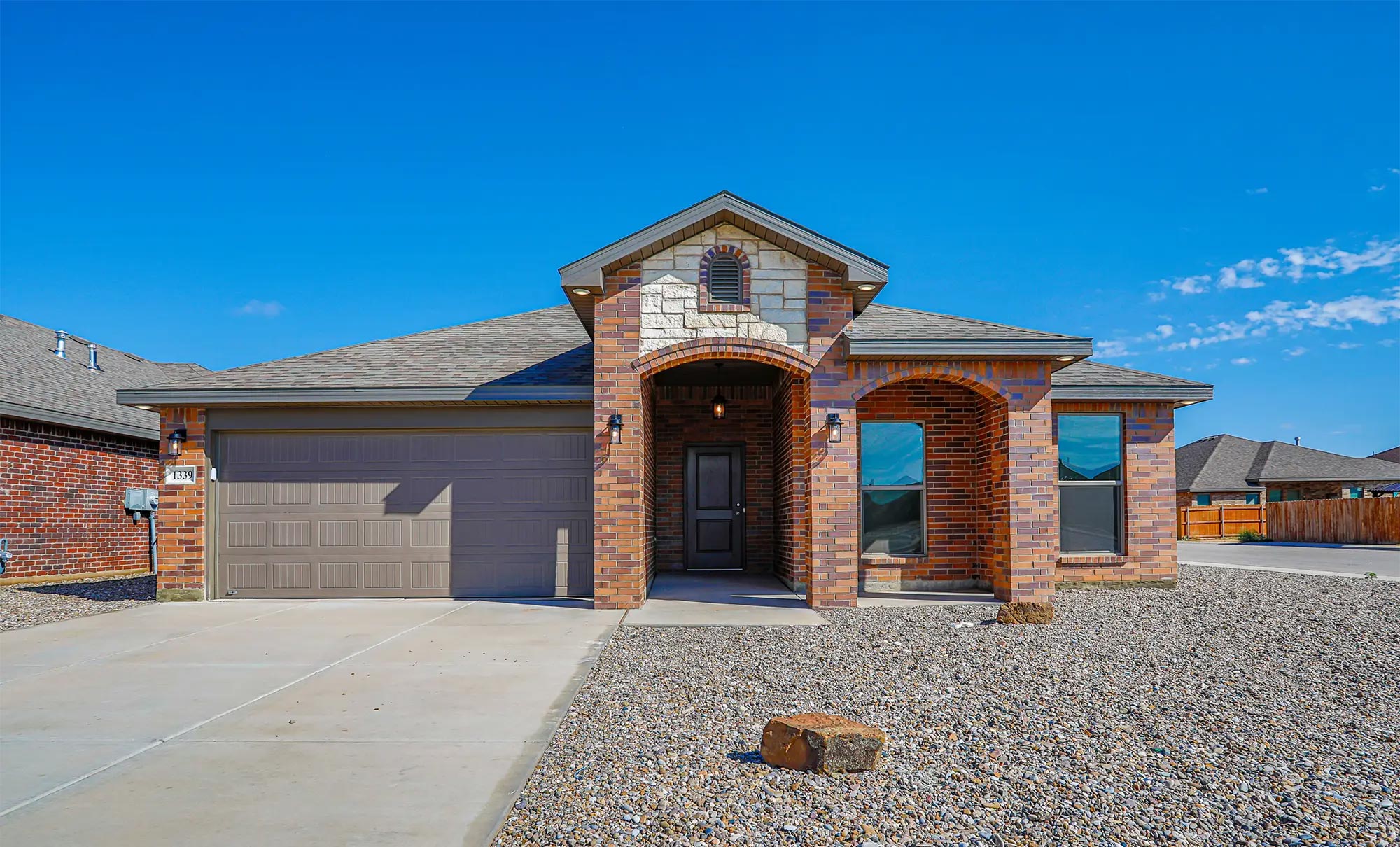 Photo of Betenbough home exterior with xeriscaping.