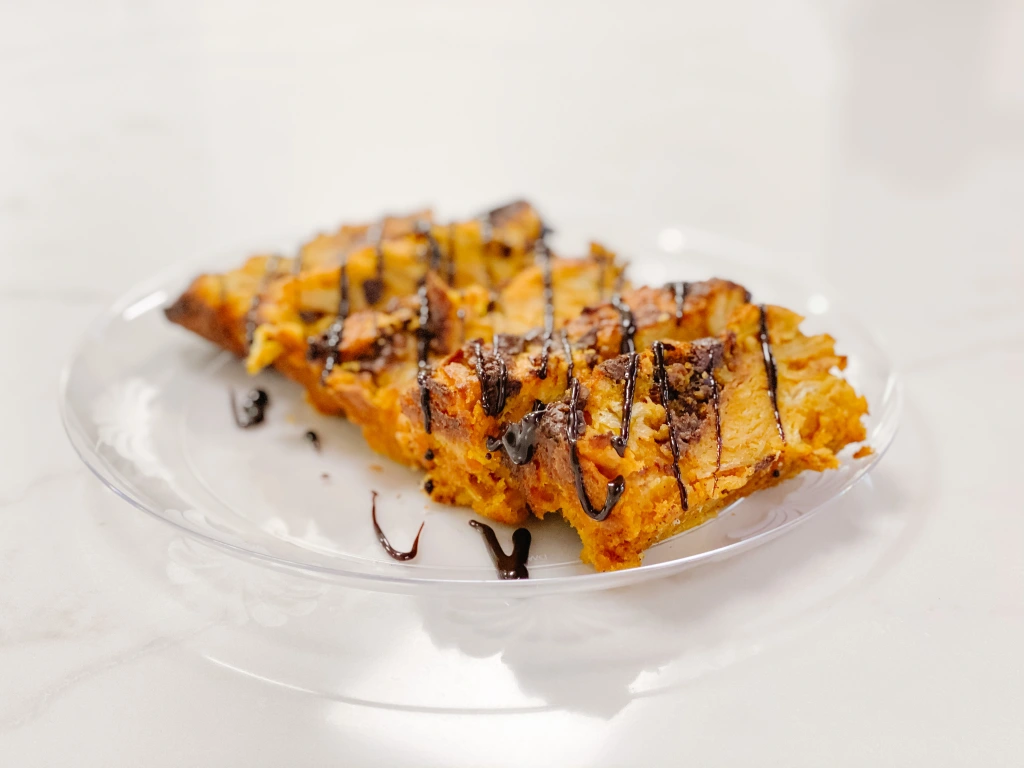 Photo of a fresh baked dessert on a plate sitting on a quartz countertop.