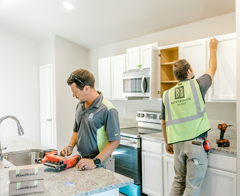 Photo of the Betenbough Homes Warranty Team doing warranty work in a new home.