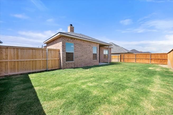 Photo of a Betenbough Home with a Bermuda grass backyard.