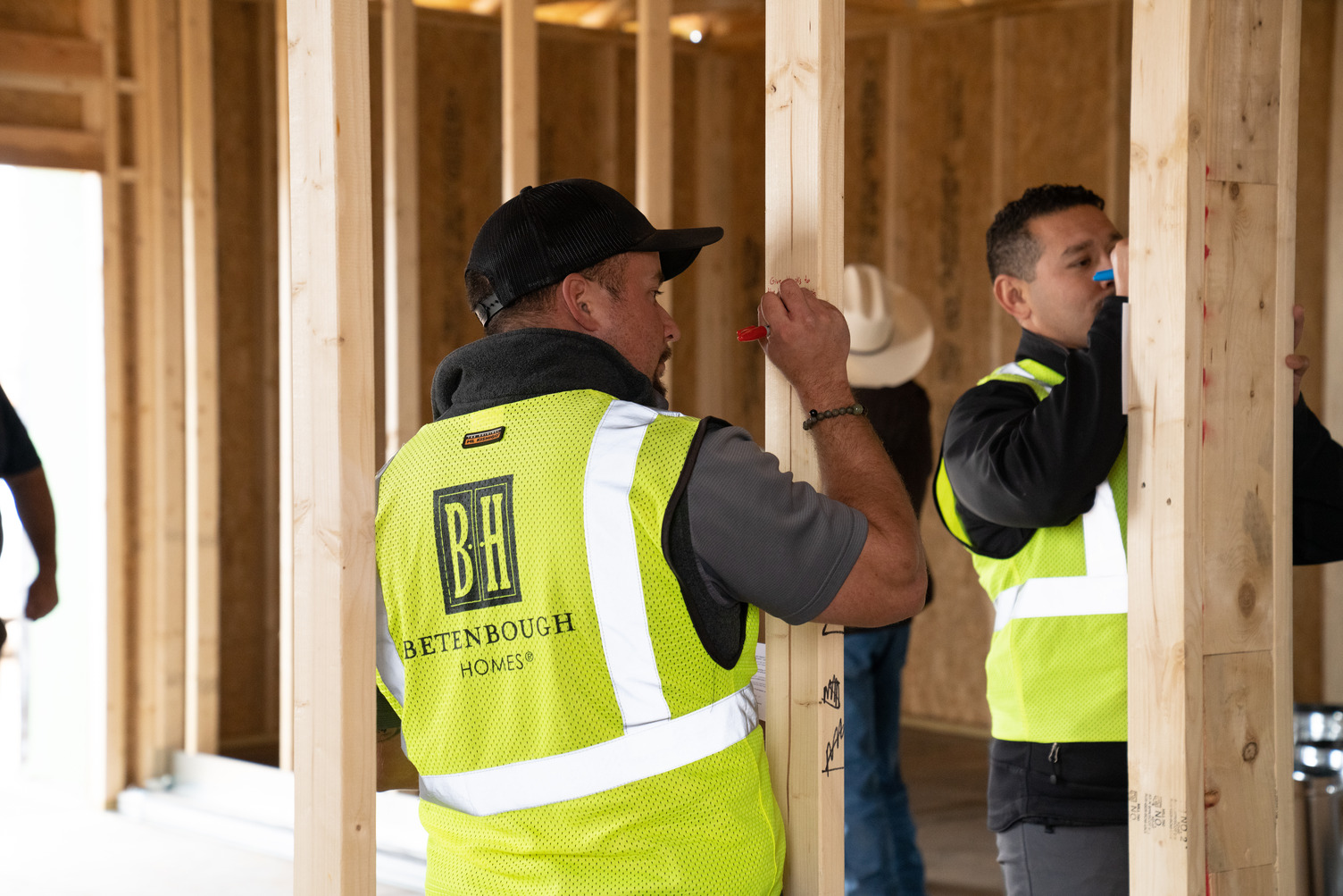 Betenbough Homes construction team signing new home frame