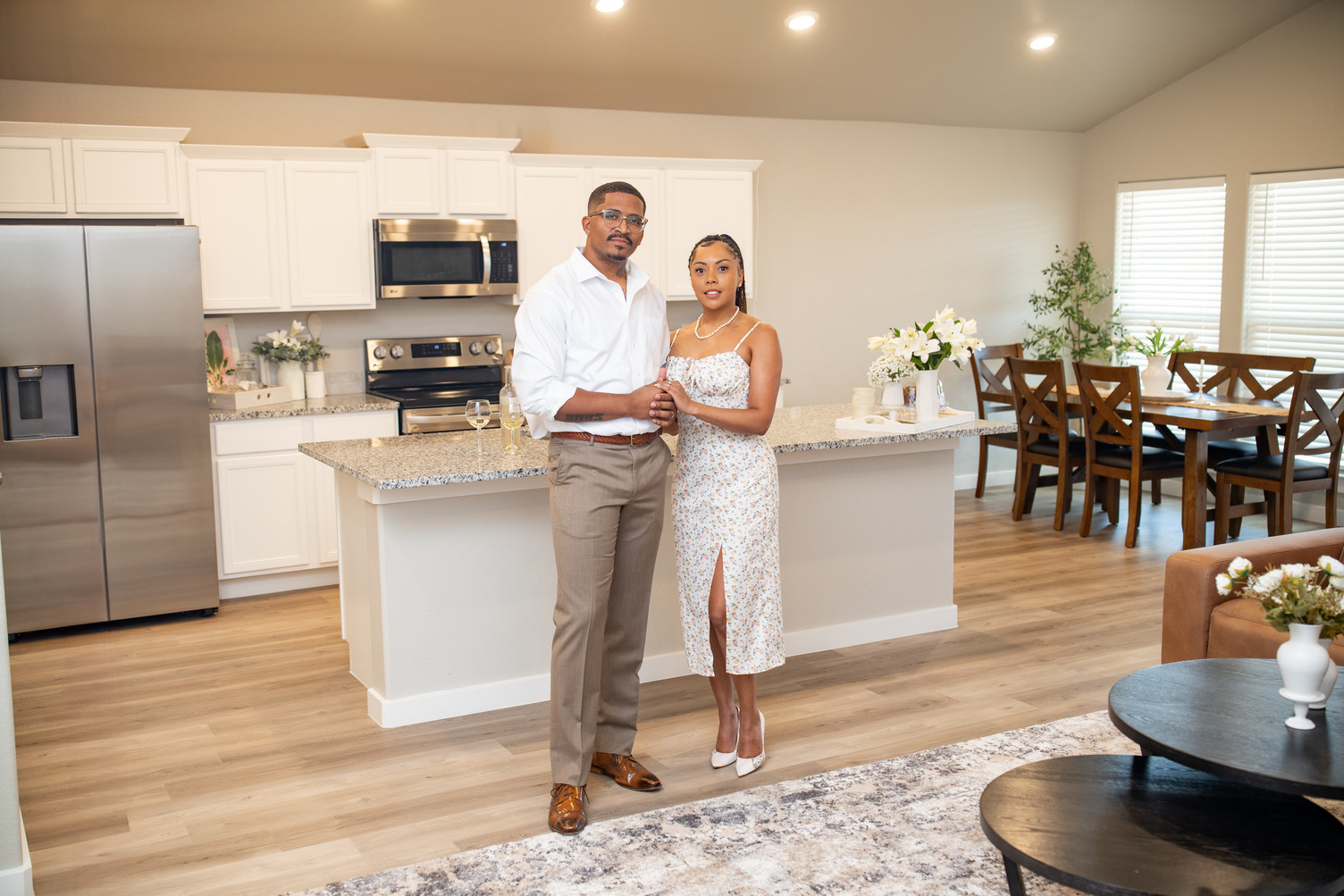 Couple standing in the kitchen of their new Betenbough Home