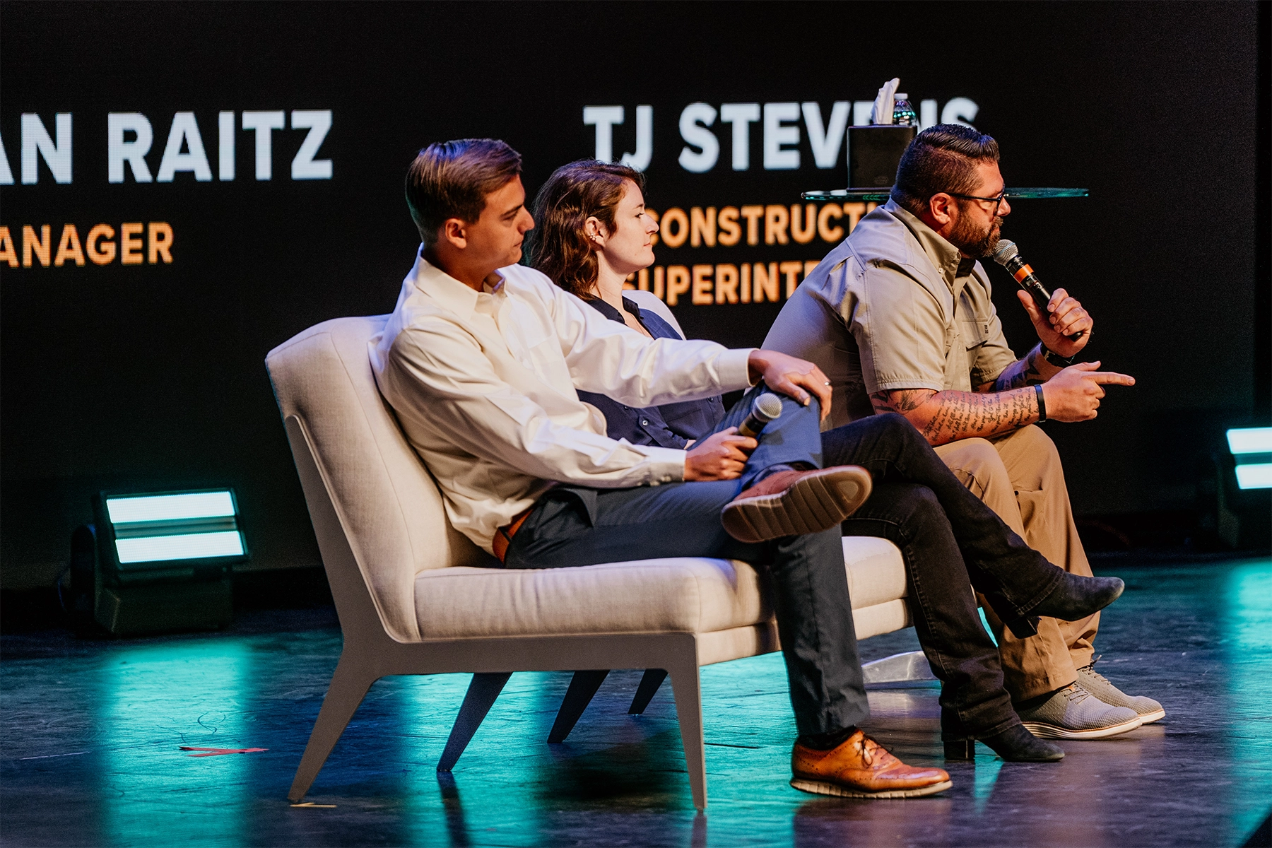 Photo of 3 panel speakers on stage at Kingdom at Work's Work With Purpose Conference.