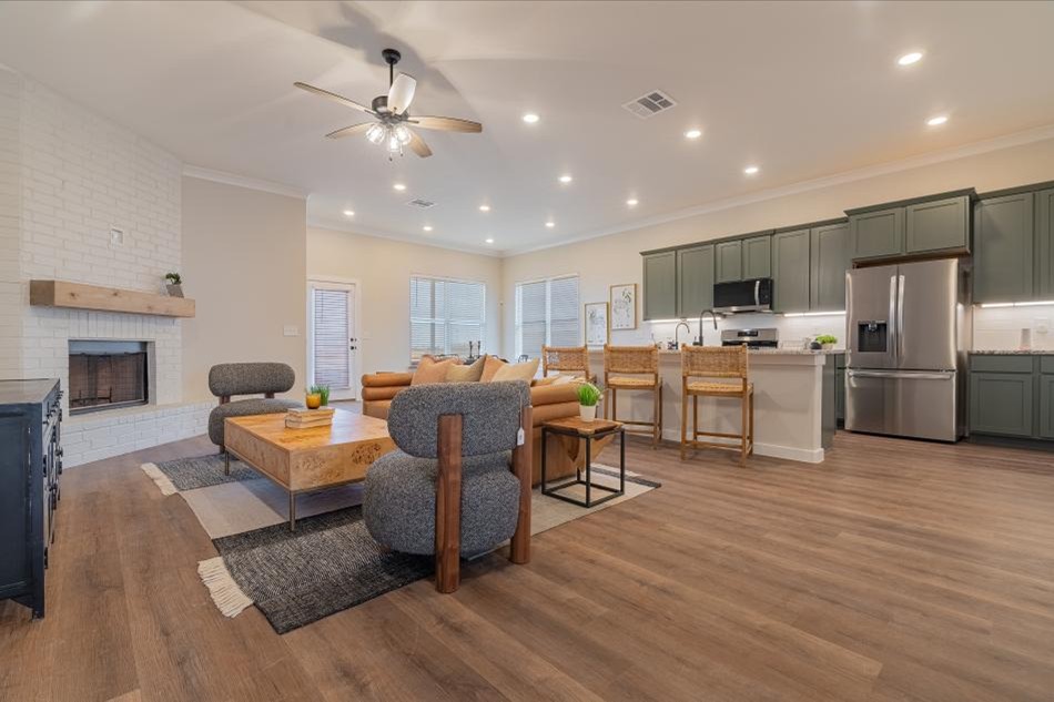 Living Comp Photo of the staged living room and kitchen in the Betenbough Homes' 2025 Amarillo Parade Home.