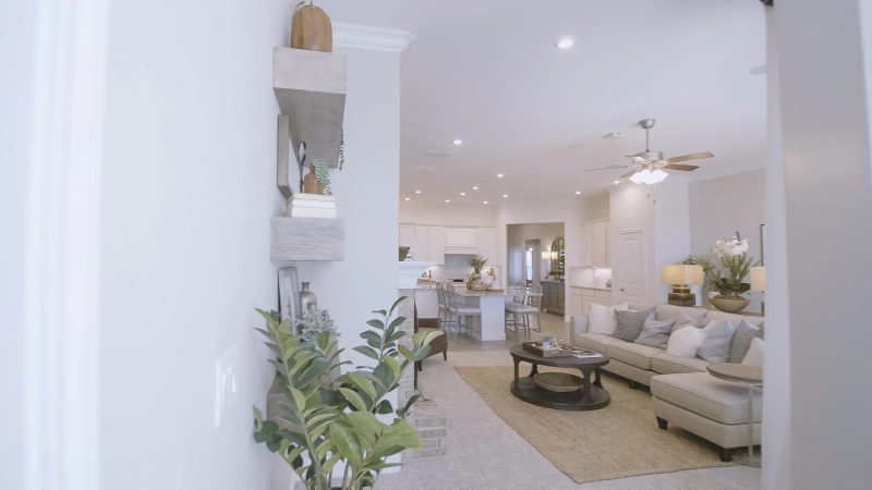 Photo of entryway looking into living room of a model home.