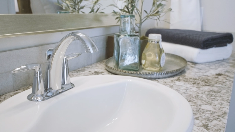 Photo of a bathroom sink and details in a Betenbough home.