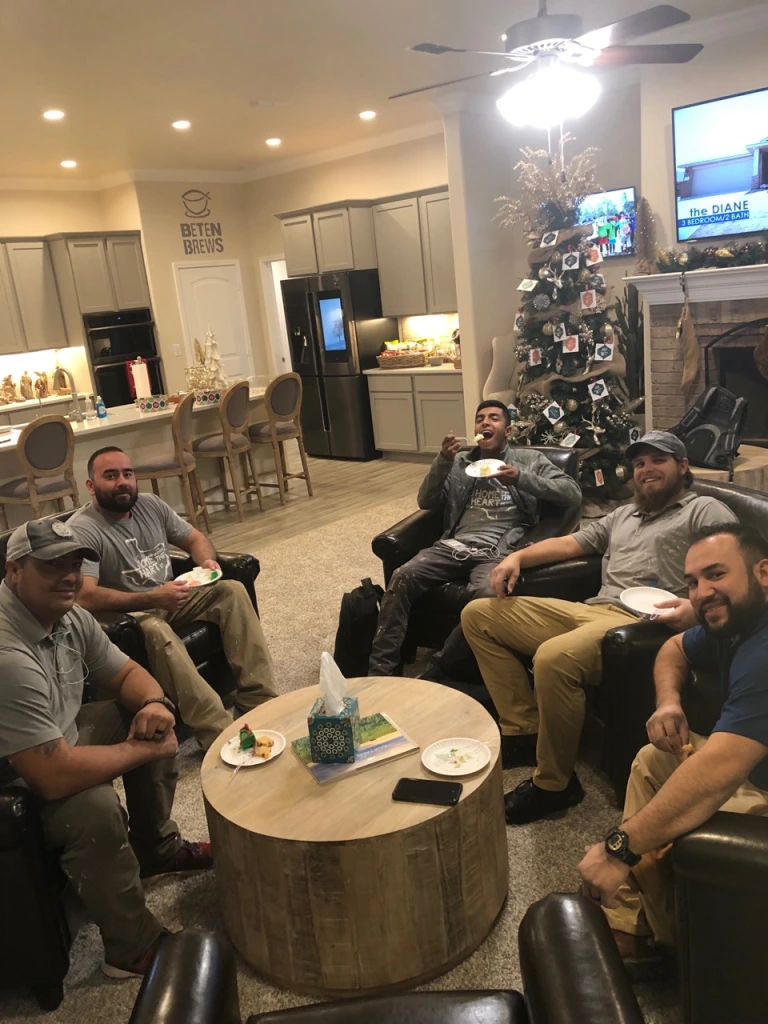 Photo of the Bell Farms team celebrating in their model home.