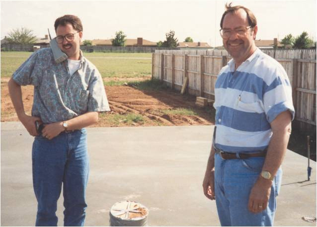 Ron and Rick Betenbough standing on the slab of a soon to be Betenbough Home