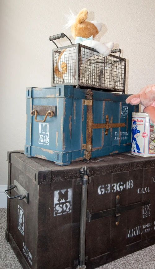 Photo of trunks and bins used as both decor and storage in a kid's playroom.