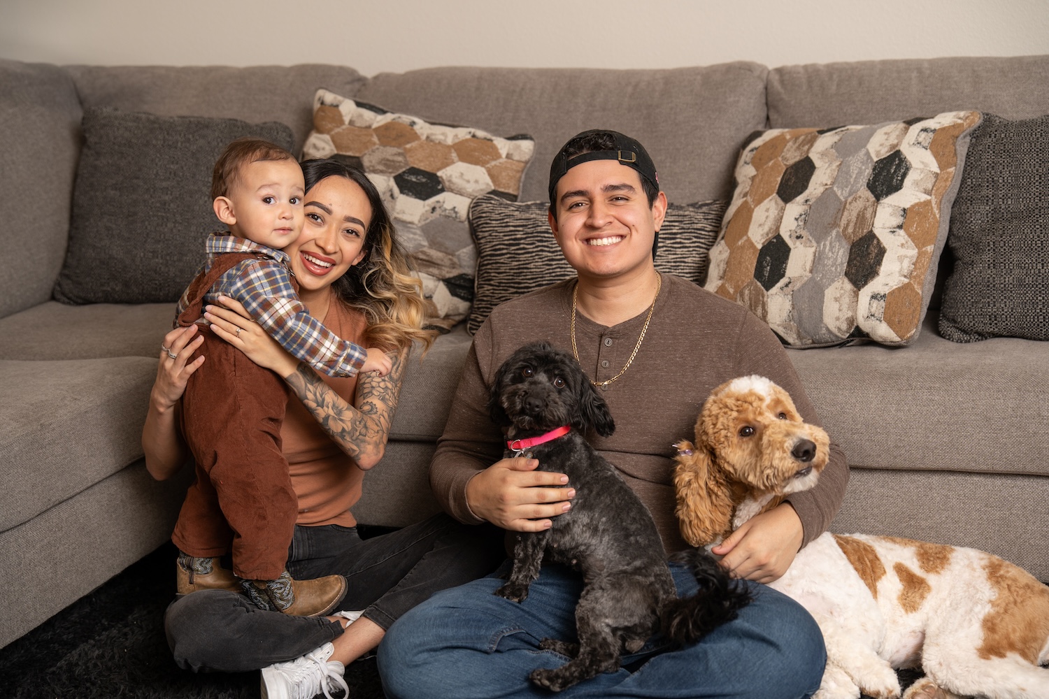 A family gathered with their dogs in the living room of their Betenbough home.