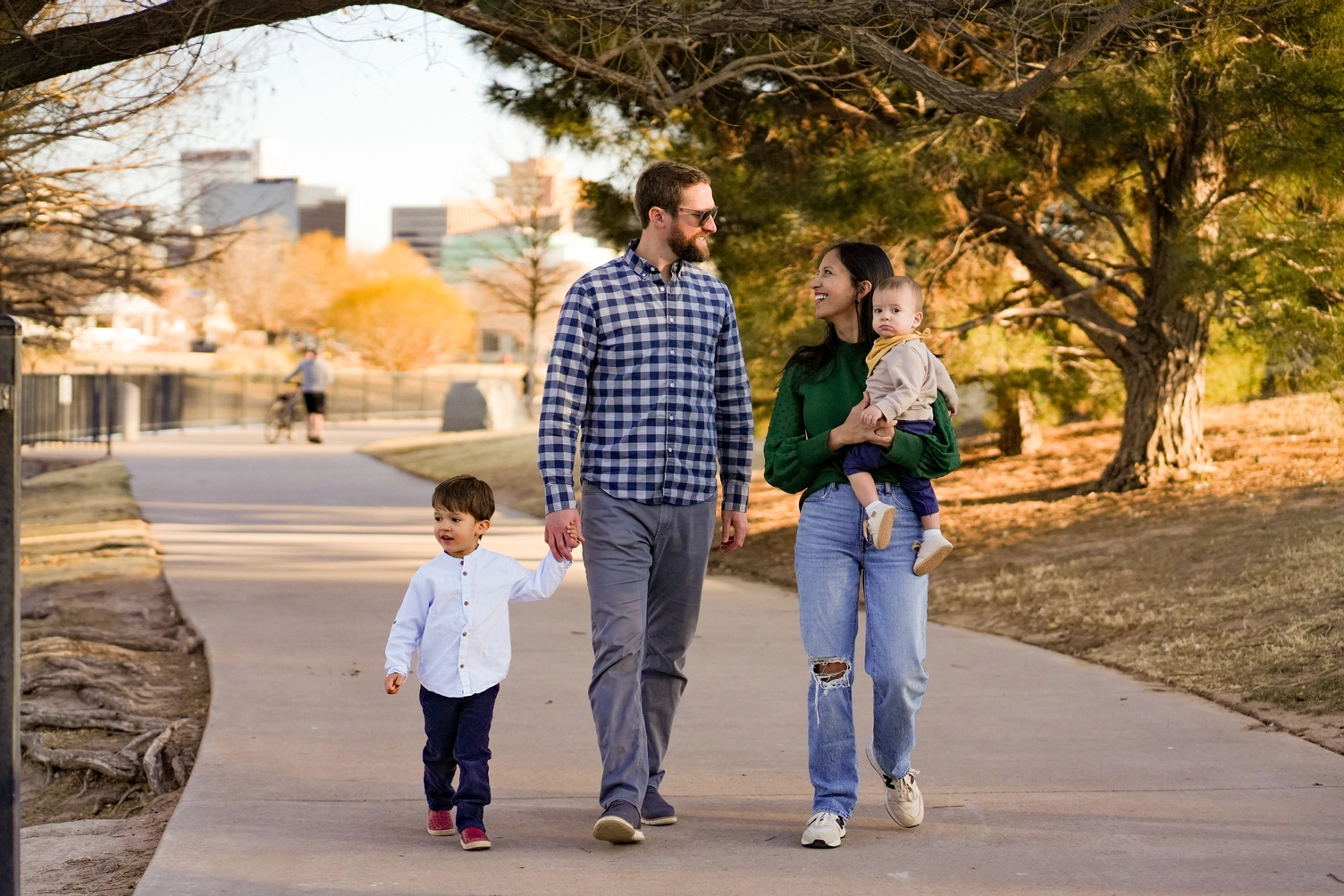 Family of four walking in the park