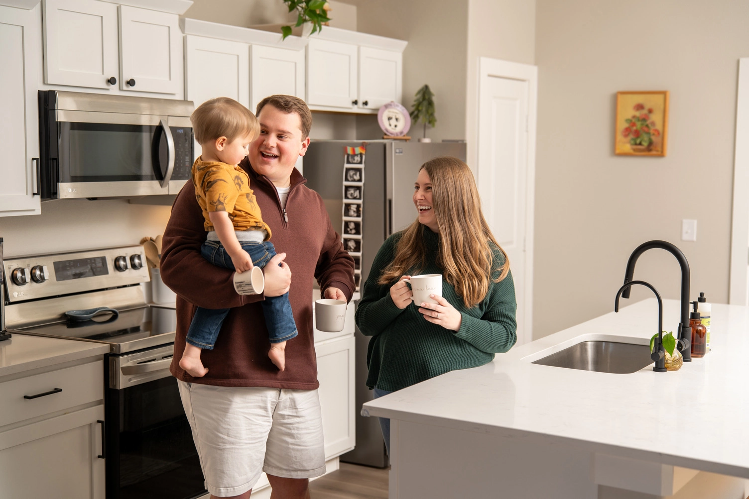 Happy family with baby in Amarillo Betenbough Home