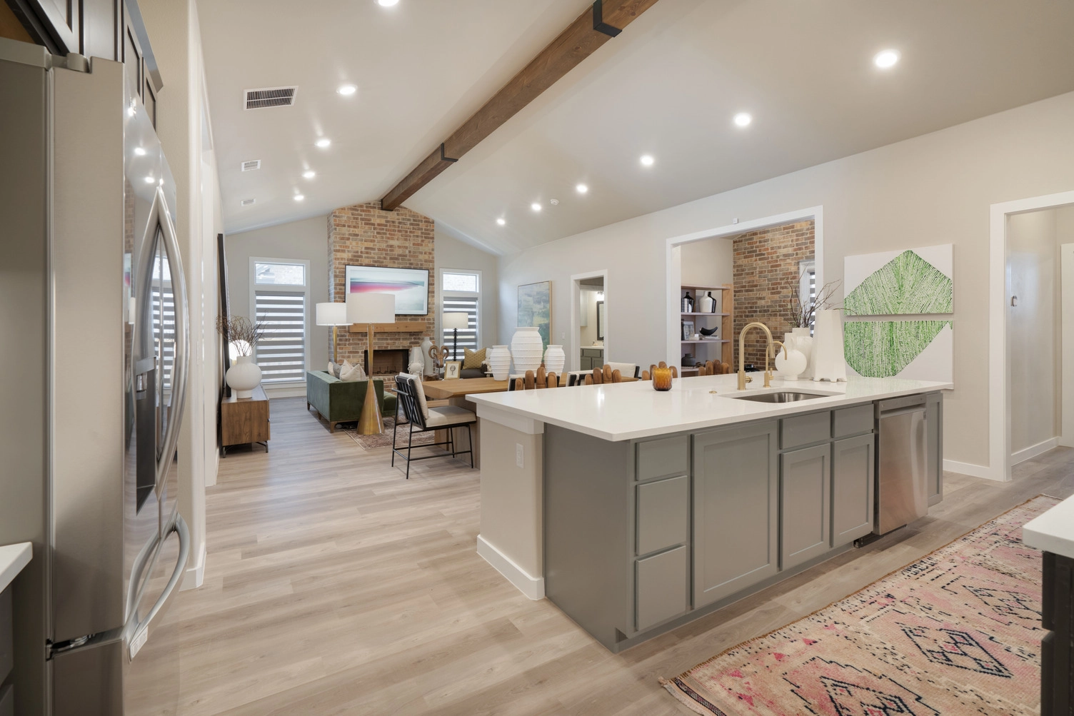 Photo of a furnished and decorated Betenbough Homes kitchen and living room.