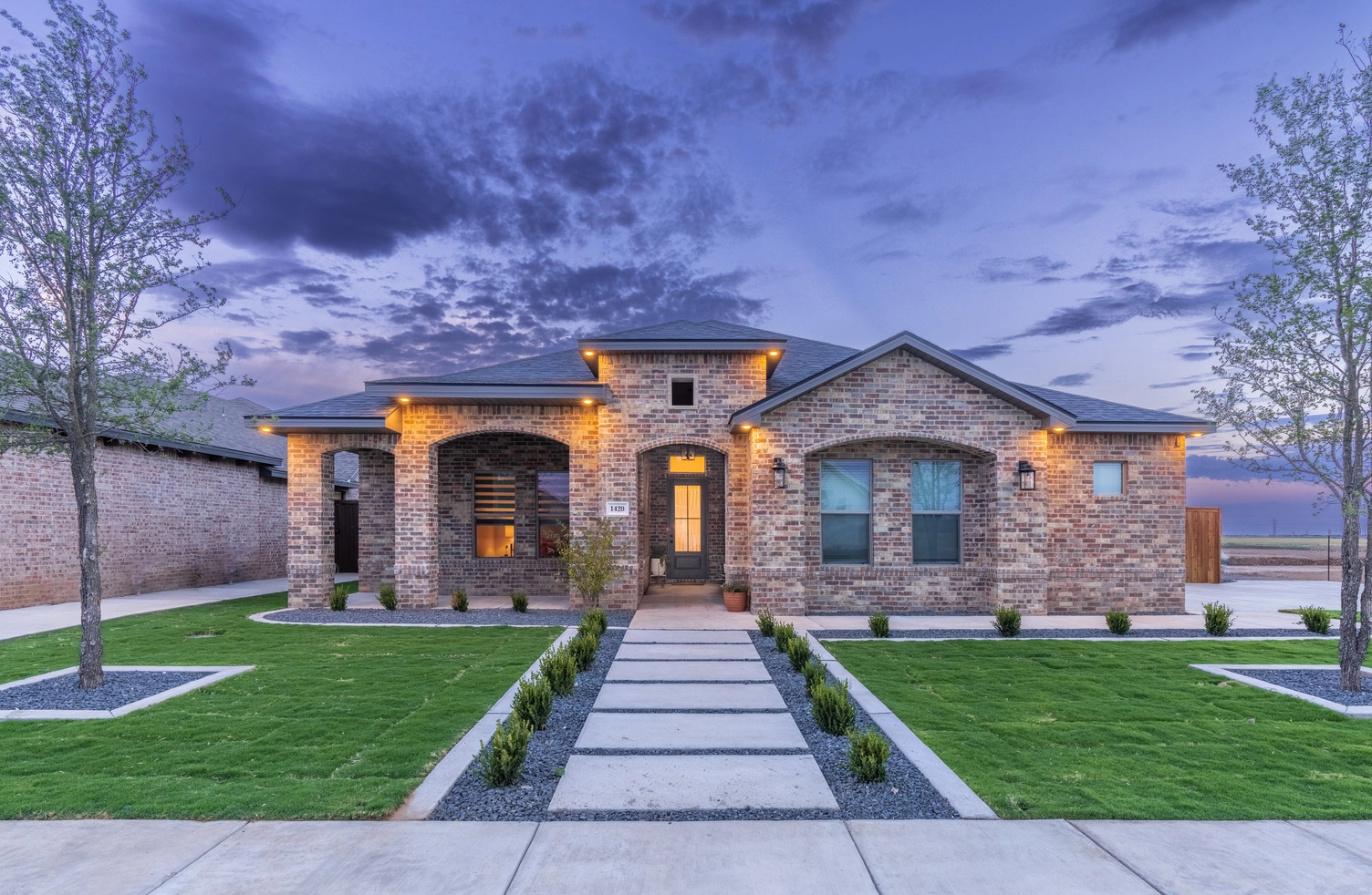 Exterior of a large Betenbough Home under Lubbock Sunset